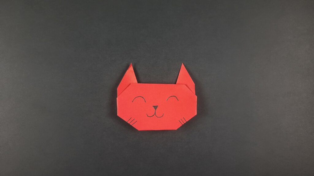 Final product for origami cat face instructions.