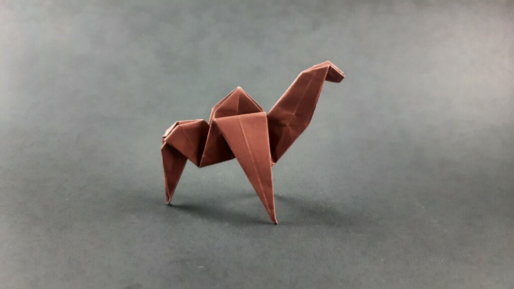 Final product for how to make an origami camel instructions.